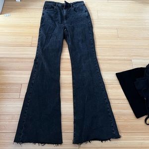 Flared. Black jeans never worn